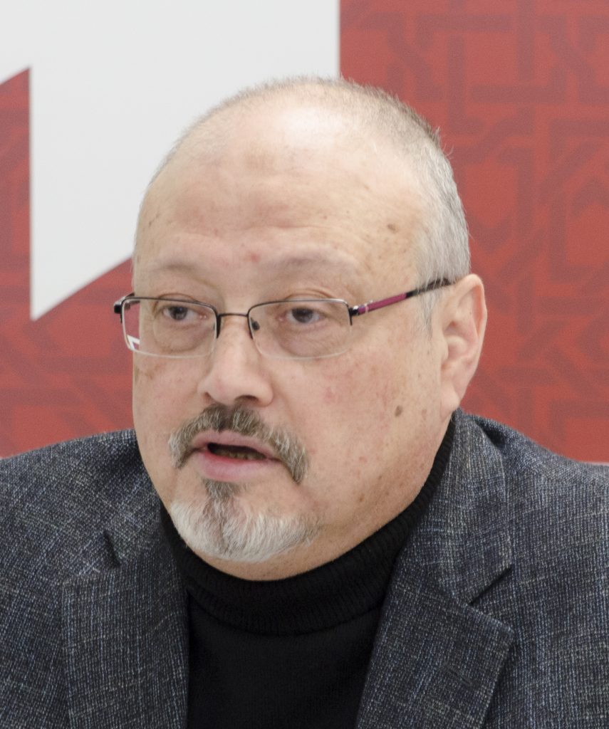 The late Jamal Khashoggi presenting at a conference. 